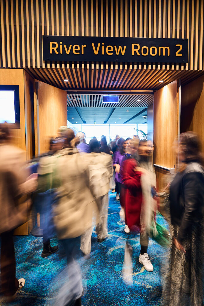 Delegates moving into River View Room 2 at SOS25