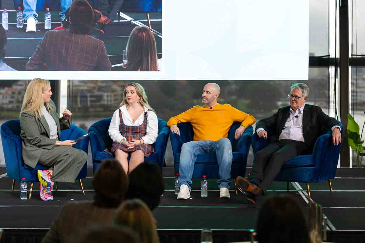 A panel discussion on stage at SOS25, Optus Stadium